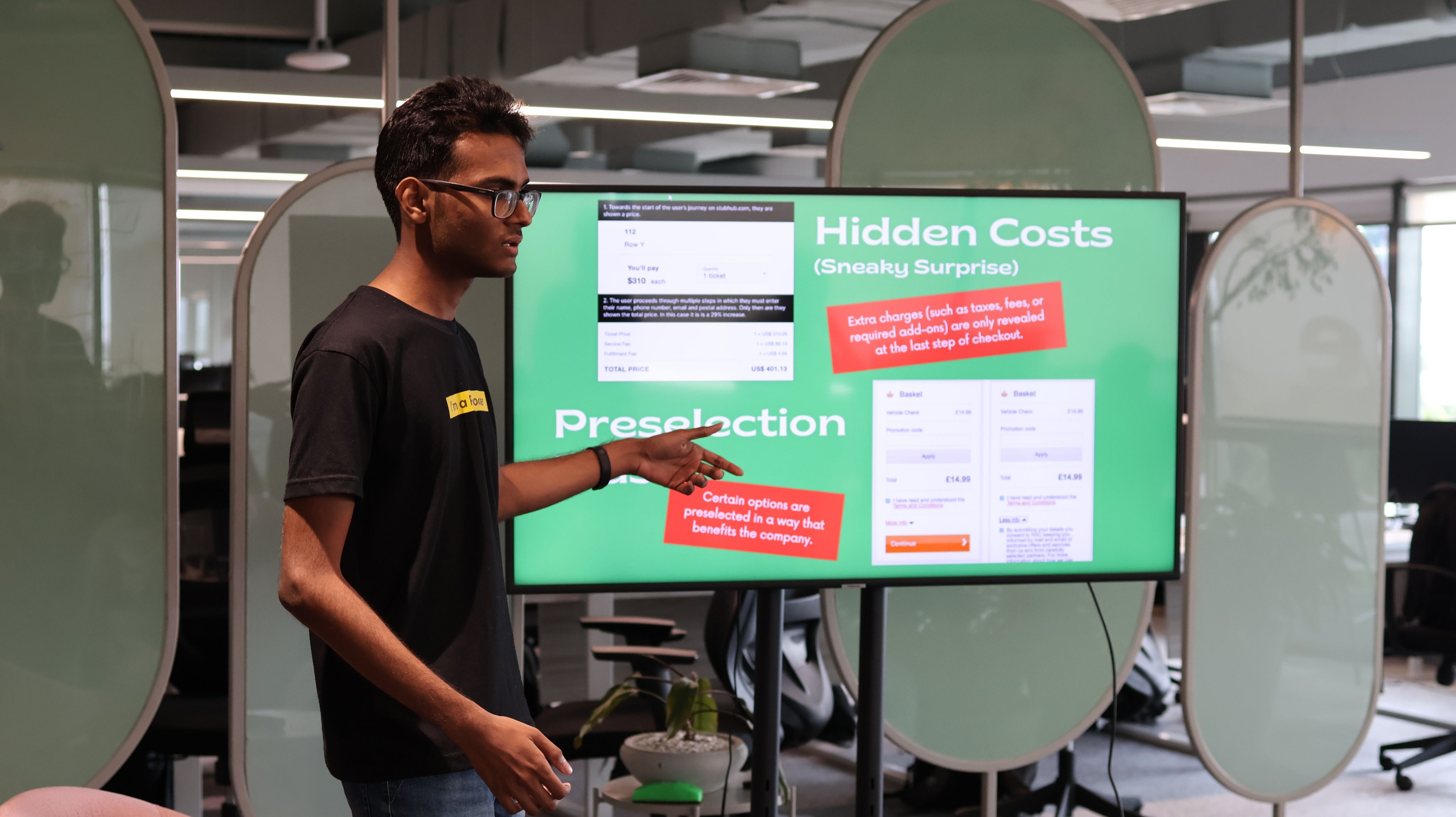 Person presenting at a screen showing presentation materials
